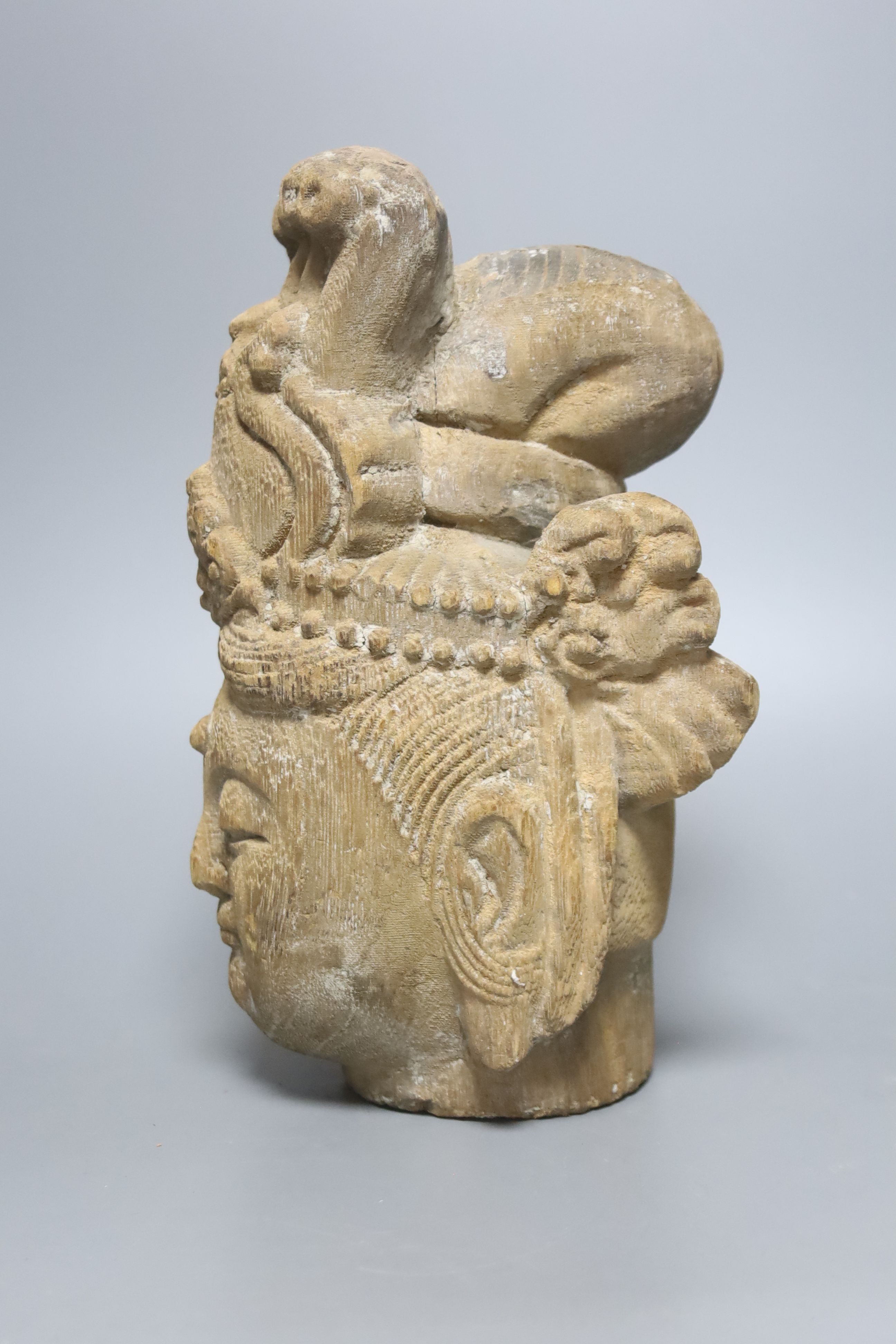 A Chinese carved wood head of Guanyin 24cm